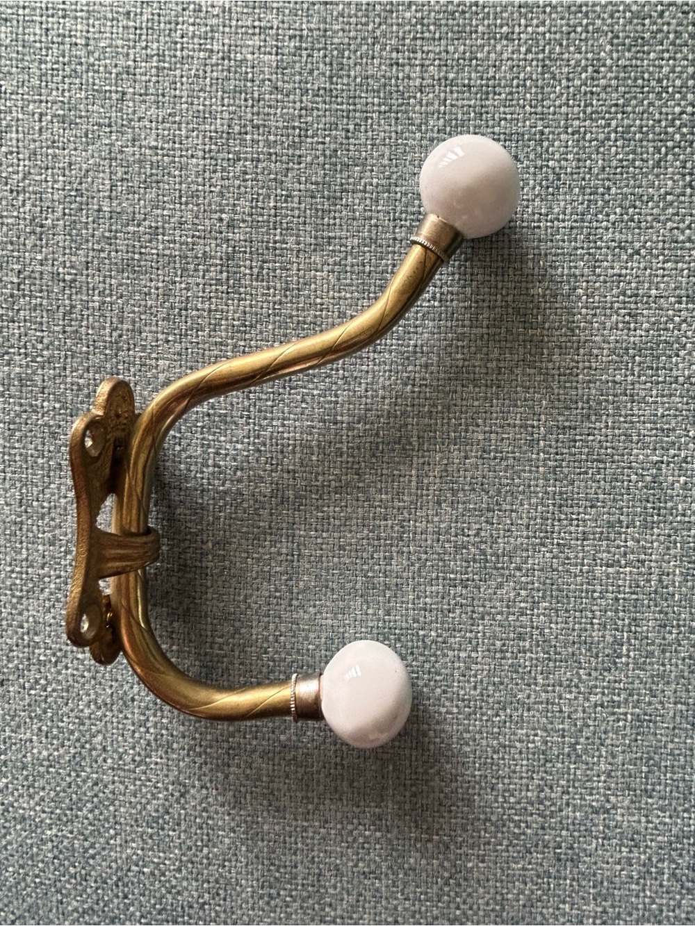 Vintage brass and porcelain door hook